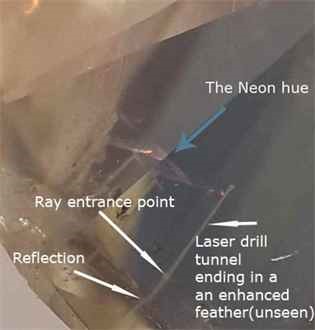 The white tunnel of the laser drill to the enhanced feather, not seen